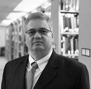 Dr. Carlos Ferran in library (Photo) 